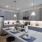 Kitchen with island and pendant lighting at Velo Riverside Apartments in Dayton, KY