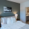 Bedroom with large connected bathroom at Velo Riverside Apartments in Dayton, KY