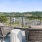 patio with view of a marina and trees at Velo Riverside Apartments in Dayton, KY