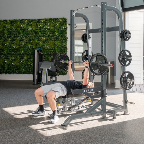 Cutting-edge amenities at your fingertips someone working out in a gym at Velo Riverside Apartments in Dayton, KY