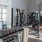 gym with exercise equipment and tv at Velo Riverside Apartments in Dayton, KY