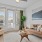 living room with a couch coffee table and large window at Velo Riverside Apartments in Dayton, KY
