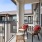 a balcony with seating and a table at Velo Riverside Apartments in Dayton, KY