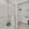 a shower and a closet in a bathroom at Velo Riverside Apartments in Dayton, KY