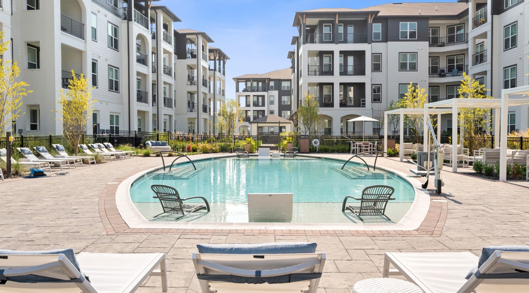 Velo Riverside A pool with plenty of seating