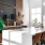 a large kitchen with a large island tvs and seating at Velo Riverside Apartments in Dayton, KY