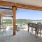 an outdoor patio with seating and a covering at Velo Riverside Apartments in Dayton, KY