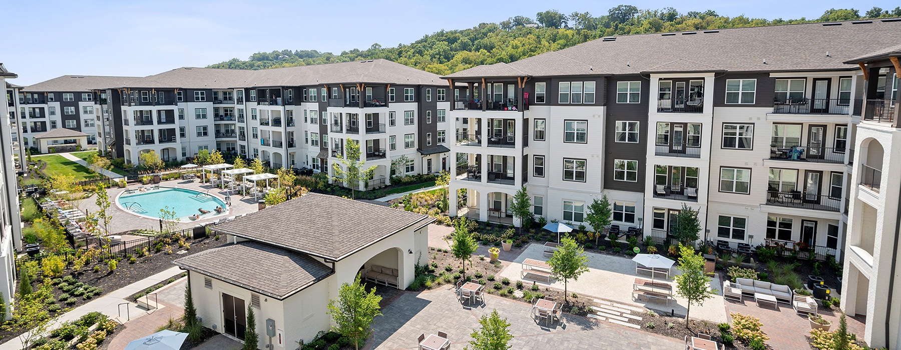 community courtyard with a pool and seating