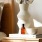 a vase with cotton stems on a bedside table  at Velo Riverside in Dayton, KY